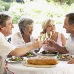 Older couples toasting with wine
