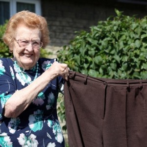 Betty Jones, 92, with a pair of her old wide-waisted trousers