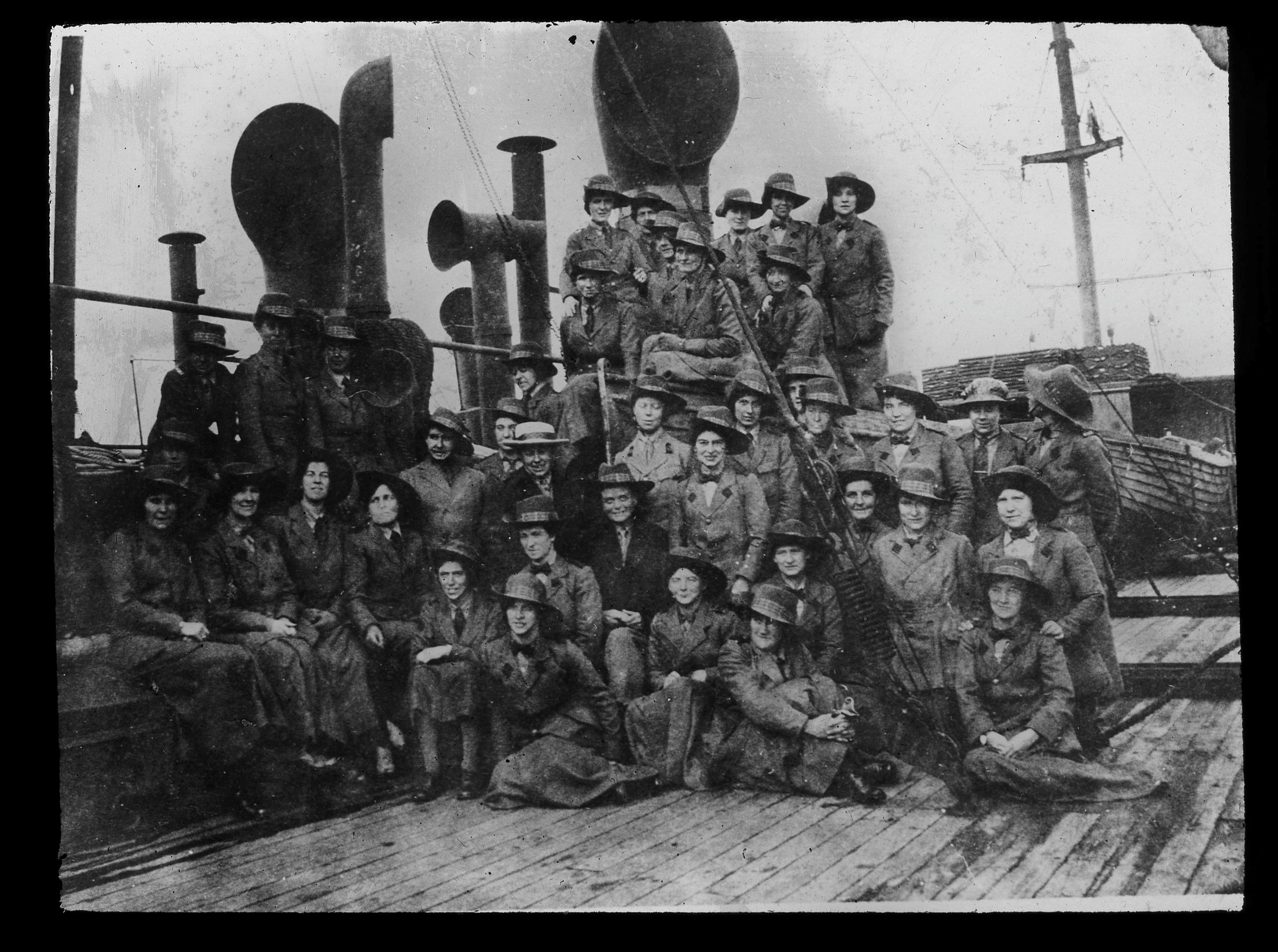 Glass plate slide of some of the Scottish WomenÃs Hospital staff on board the ship Huntspill, bound for Archangel in Russia, September 1916.  Dr Inglis is seated in the centre wearing a trilby hat.. See Centrepress story CPMEDALS; Staff at a Scots museum have uncovered the remarkable story of a cook who travelled across Europe during the First World War - after finding a collection of 90-year-old medals.  Curators were researching items for a National Museum of Scotland's WW1 touring exhibition when they found a collection of medals from the conflict, including a Scottish Women's Hospital Lapel Badge.  Also found at Hawick Museum, Borders, were a collection of glass plate photographic slides and a certificate from the Serbian Government. All of the items had belonged to Mary Lee Milne, who sailed to Southern Russia with the Scottish Women's Hospital (SWH) in August 1916, receiving two medals for her war efforts abroad. Credit SWNS
