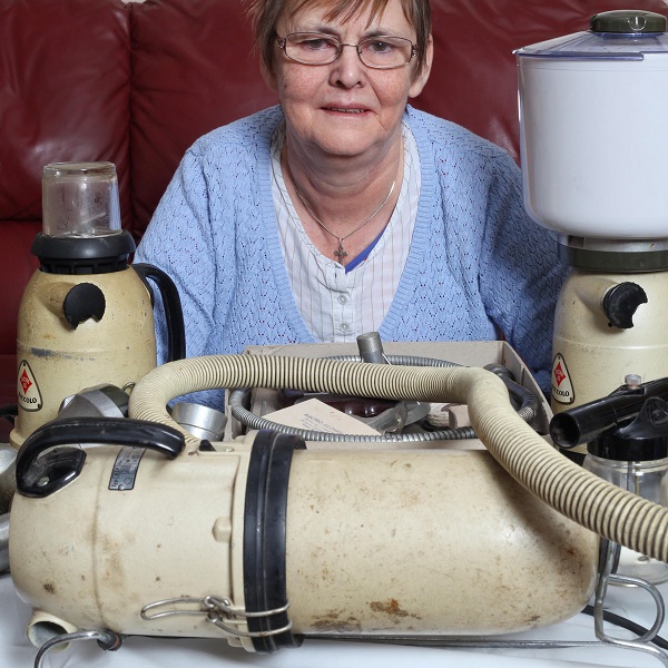 Mary Waite from Halesowen, Birmingham with her Piccolo machine.See News Team story NTIPICCOLO; A gran is the proud owner of the world's oldest and most versatile household appliance - which makes dinner, hoovers, paints and even grinds coffee beans. Mary Waite, 63, and her husband Ivor, 65, have been using their Piccolo multi-purpose appliance since it was given to them as a wedding present in 1976. Remarkably, the old plastic and metal gadget, which does four household chores in one still works today and has never broken down.