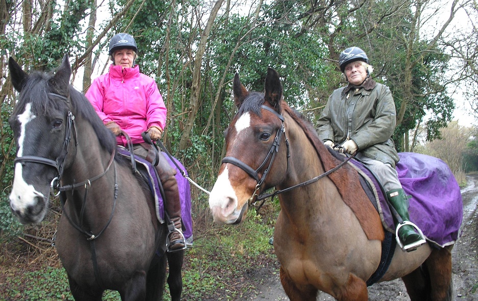 L-R: Anthea Chambers, owner of Wildwoods Equestrian Centre, out riding with Joy Folkard. See SWNS story SWHORSE; A sprightly gran showed age is no barrier to horsing around as she celebrated her 90th birthday on horseback. Joy Folkard, who served with the Woman's Royal Naval Service during the Second World War, celebrated her milestone birthday riding 22-year-old Dancer. The thrill seeker, from Leatherhead, Surrey celebrated her 80th birthday with a skydive, and is now planning how she will mark turning 100. The riding session was organised by Age Concern worker Suye Merchant last month.