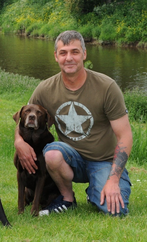 Martin Green with Wispa the dog which helped Pete Alderson - Copyright SWNS.com - Credit SWNS.com 