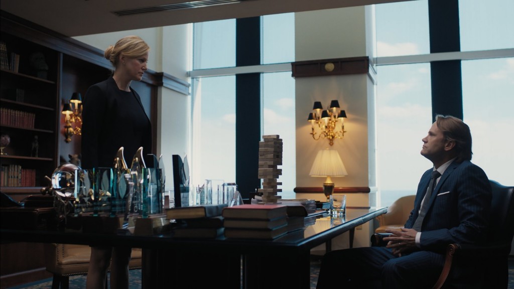 woman in front of desk in film Equity