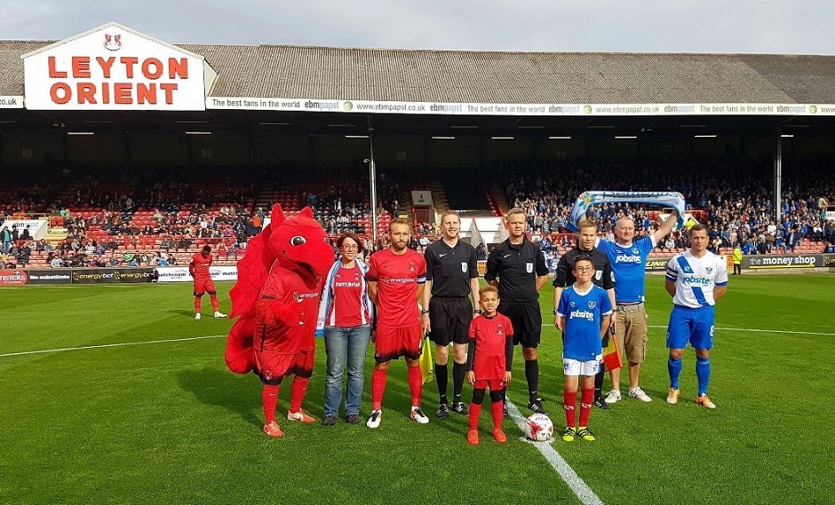 football team before kick off with mascots