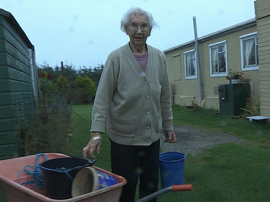 elderly lady with buckets