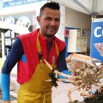 French market - Man holding spider crab