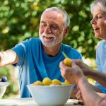 Older people peeling fruit