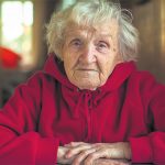 Elderly woman in hoody