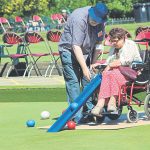 Older woman playing bowls