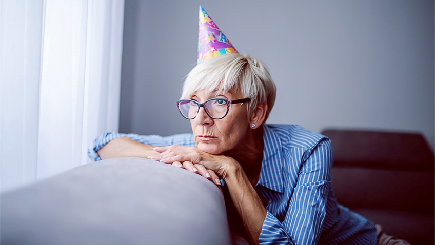Lonely woman with party hat - MT Folio