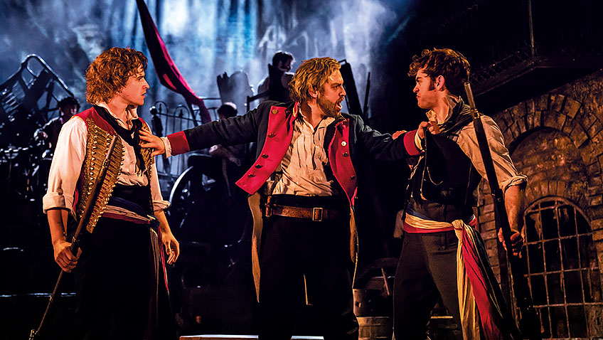 Ashley Gilmour, Jon Robyns and Harry Apps in Les Misérables - Credit Johan Persson