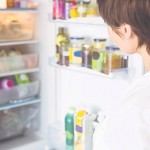 Woman looking in fridge