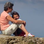 Older woman on rock with grandchild - Open plan - Free for commercial use - No attribution required - Credit Pixabay