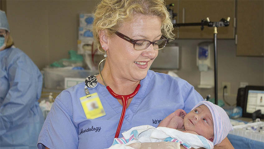 NHS nurse with baby