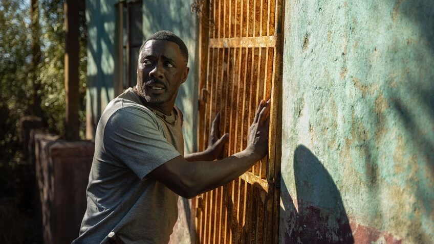 Idris Elba wrestles with a CGI lion in survival film Beast