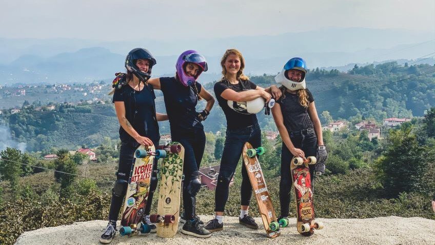 There’s more campervan driving than downhill racing in this female centric longboarding documentary.