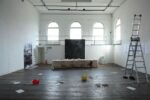 An intriguing exhibition reflecting memory and loss through architectural and archaeological motifs.